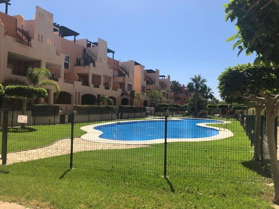 Bajo Con Jardin A Pie De Playa Y Piscina Comunitaria Con Jacuzzi Appartement Playas de Vera Buitenkant foto